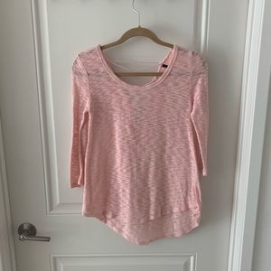 Pink blouse lace-up in the back.